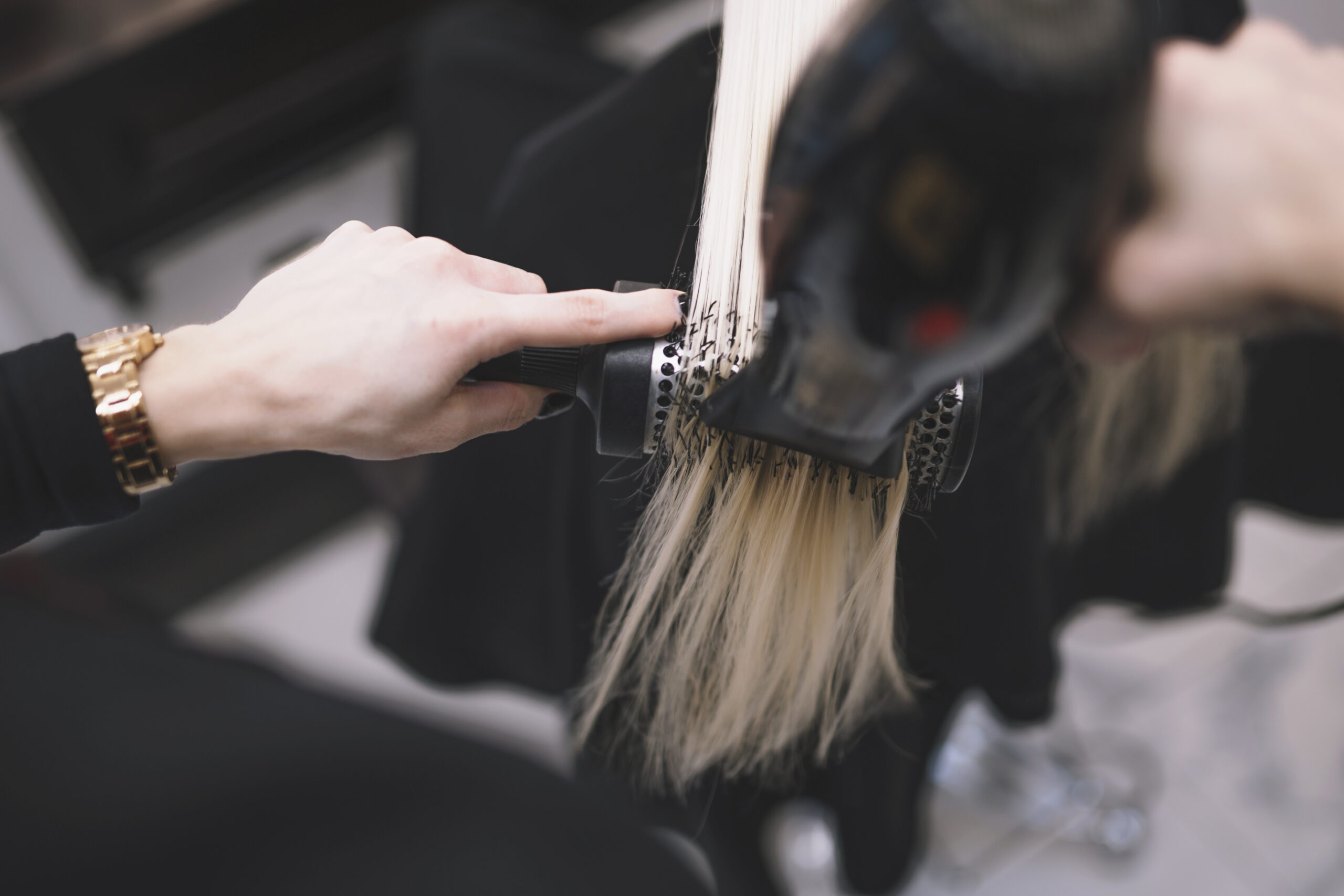crop-stylist-setting-hair-with-brush